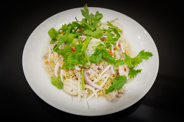Instant noodle spicy salad Thai style food on white plate