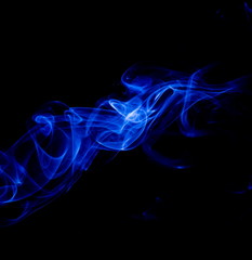 Blue smoke on black background