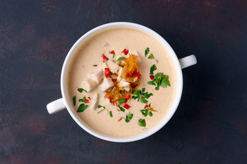 Soup puree with veal, fried onion, carrot and pepper