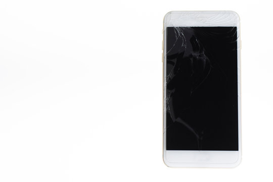 Horizontal image of Phone with broken retina display screen isolated on white. And which the iPhone is placed on the right hand side of the image.