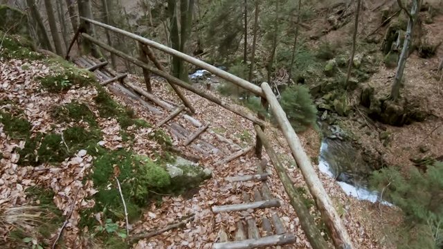 Exploring and walking carefully along a wooden trail in Vintgar. Bistriski Vintgar Slovenia. Moving camera