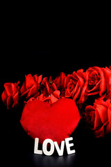 Heart shape, Wooden letters word "LOVE" and red rose on black background