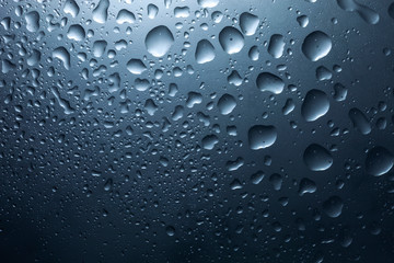 Water drops on dark wall and light, water drop for background and design