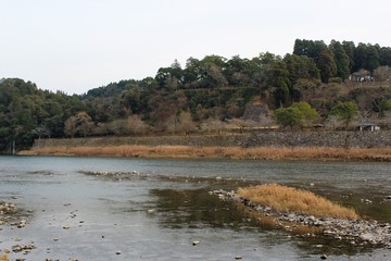 Fototapeta na wymiar Kuma River flows by a historic castle site in Japan