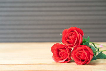 Red rose on the old wood