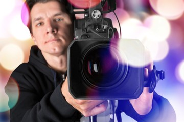 Cameraman working with camera  on background