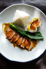 Grilled pork, boiled egg with steamed jasmine rice