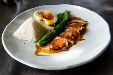 Grilled pork, boiled egg with steamed jasmine rice
