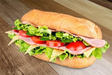 Ham and cheese salad submarine sandwich from freshly cut