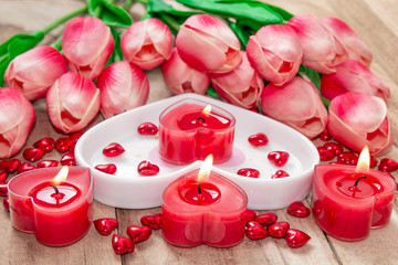 Valentine's Day Tulips, a heart-shaped plate and a heart-shaped candle.