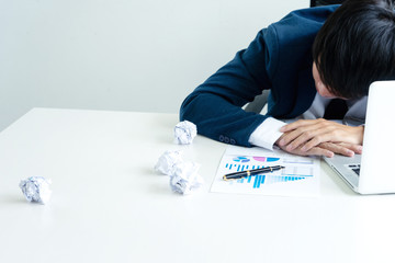 businessman sit at the table fill sad and headache