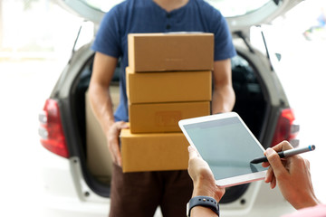 worker man delivery the boxs to woman