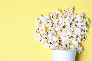 popcorn on a yellow background close-up, top view, texture