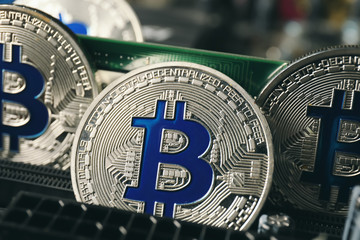 Bitcoins on PC circuit board, closeup