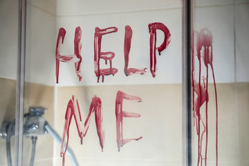 Text HELP ME written in blood on glass door of shower cabin - obrazy, fototapety, plakaty