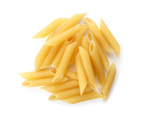 Uncooked penne pasta on white background
