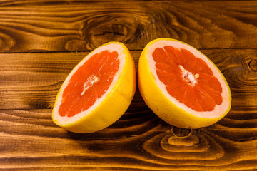 Ripe juicy grapefruit on a wooden table