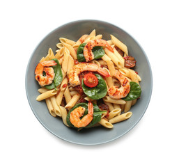 Plate of tasty pasta with shrimps and tomatoes on white background