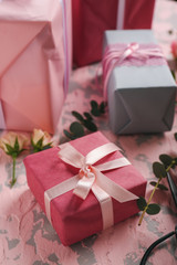 Festive gift boxes on color background