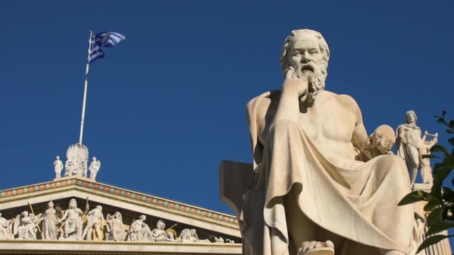 Exterior shot of the facade of the Academy of Athens and the statue of Greek philosopher Socrates, Greece
