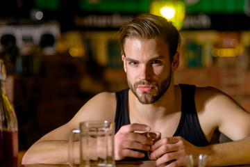 Grabbing a drink after work. Man drink strong alcoholic beverage and beer in pub. Alcoholic man drinking at bar counter. Alcohol addict with short alcohol drink. Alcohol addiction and bad habit