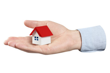 Hand holding a small house, isolated on white background