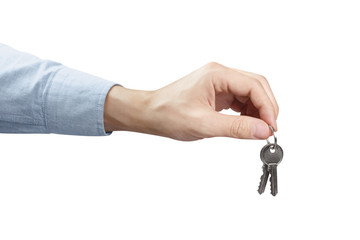 Hand holding keys, isolated on white background