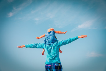 happy father and daughter play at sky