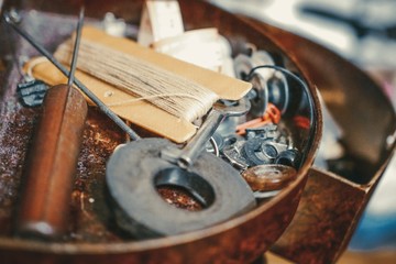 Sewing accessories are scattered on the shelf