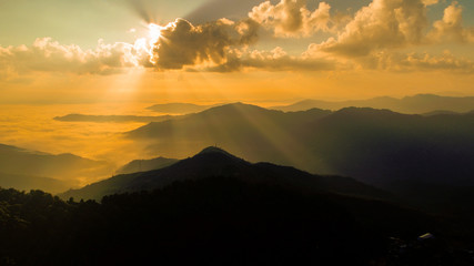 Sunrise over the mountain landscape, A beautiful sun rays with clouds 