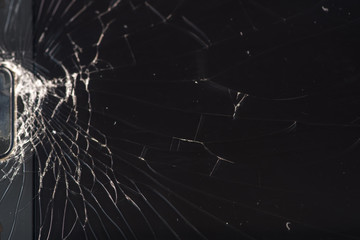 Broken smartphone screen, cracks and shattered glass under various eels