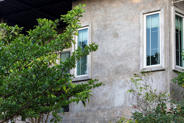 Fototapeta na wymiar Closeup of loft style of home in green garden