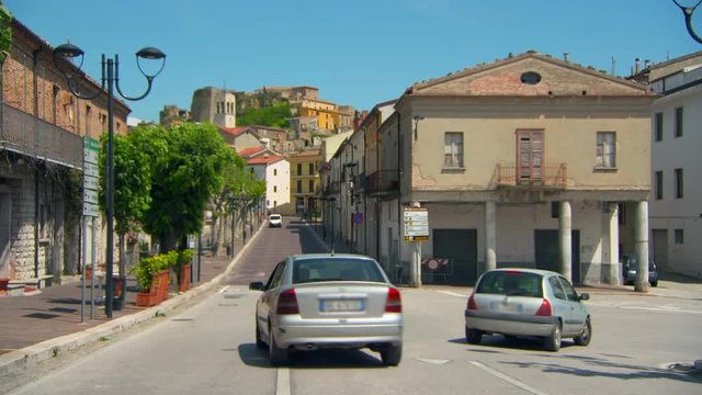 Wide Angle: Cars Driving in a Small Town