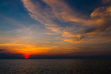 Naklejka na ściany i meble Sunset sky above the sea