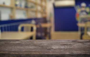 Empty wood table top and blur of night market background/selective focus .For montage product display.