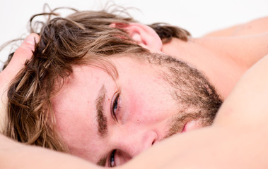 Man unshaven bearded face sleep relax or just wake up. Guy bearded macho relax in morning. Total...