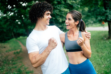 Fototapeta premium Happy young people jogging and exercising in nature