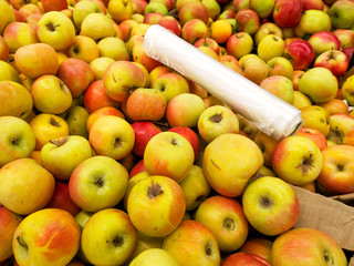 Ripe apples in the store as background