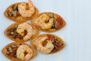 Prawns with mushrooms, tomatoes and onion. Delicious snack.