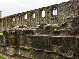 Fragment of Middle Ages stone wall in perspective. Scotland, public places.