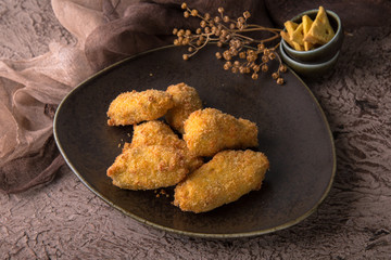 Juicy, crispy chicken wings breaded. Fast food