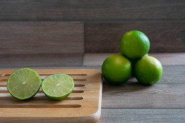 Cut limes on wooden tray