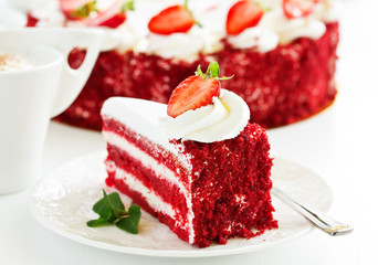 a piece of delicious red velvet cake on a plate.