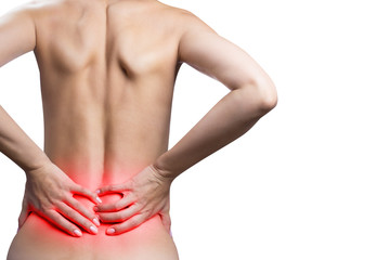 Woman suffering from a lower back pain, isolated on white background