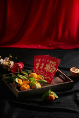 concept image of the lunar new year -mandarin orange and red packet
