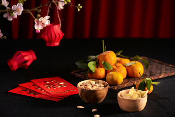 Concept image of the lunar new year - mandarin orange, jam and red packet