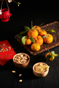 Concept image of the lunar new year - mandarin orange, jam and red packet