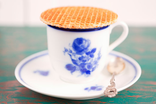 Cup of coffee with a Dutch stroopwafel cookie