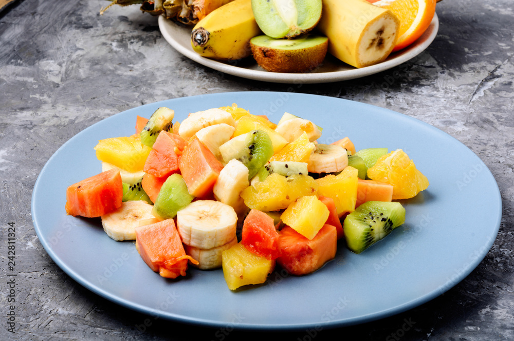 Wall mural Bowl of healthy fresh fruit salad