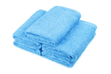 Clean blue towels, isolated on white background